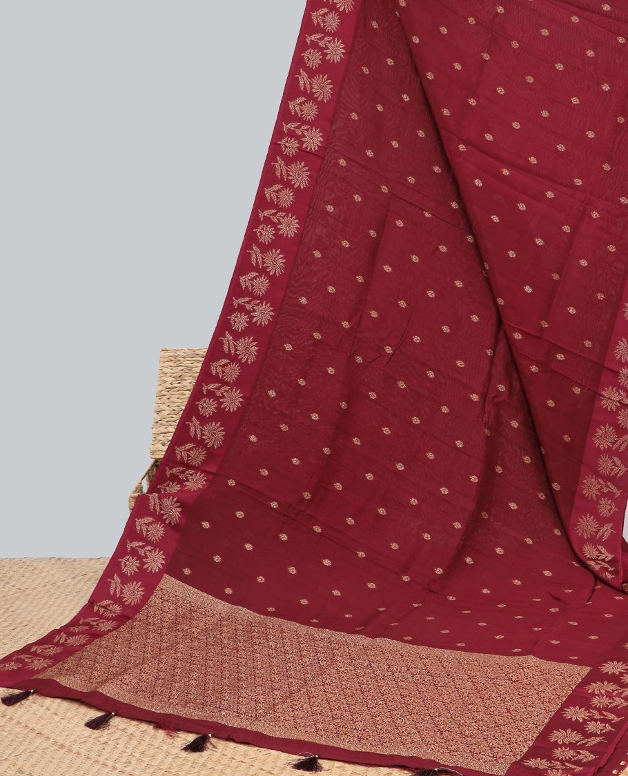 Maroon floral buttas dola silk saree with self floral design border & intricate zari design pallu