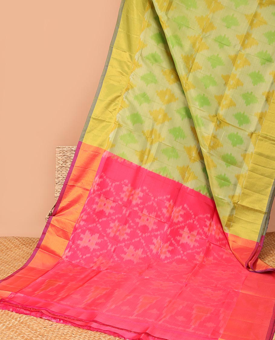 Yellow ikkat motifs semi-uppada saree with contrast zari border & ogge design enclosed with floral design pallu