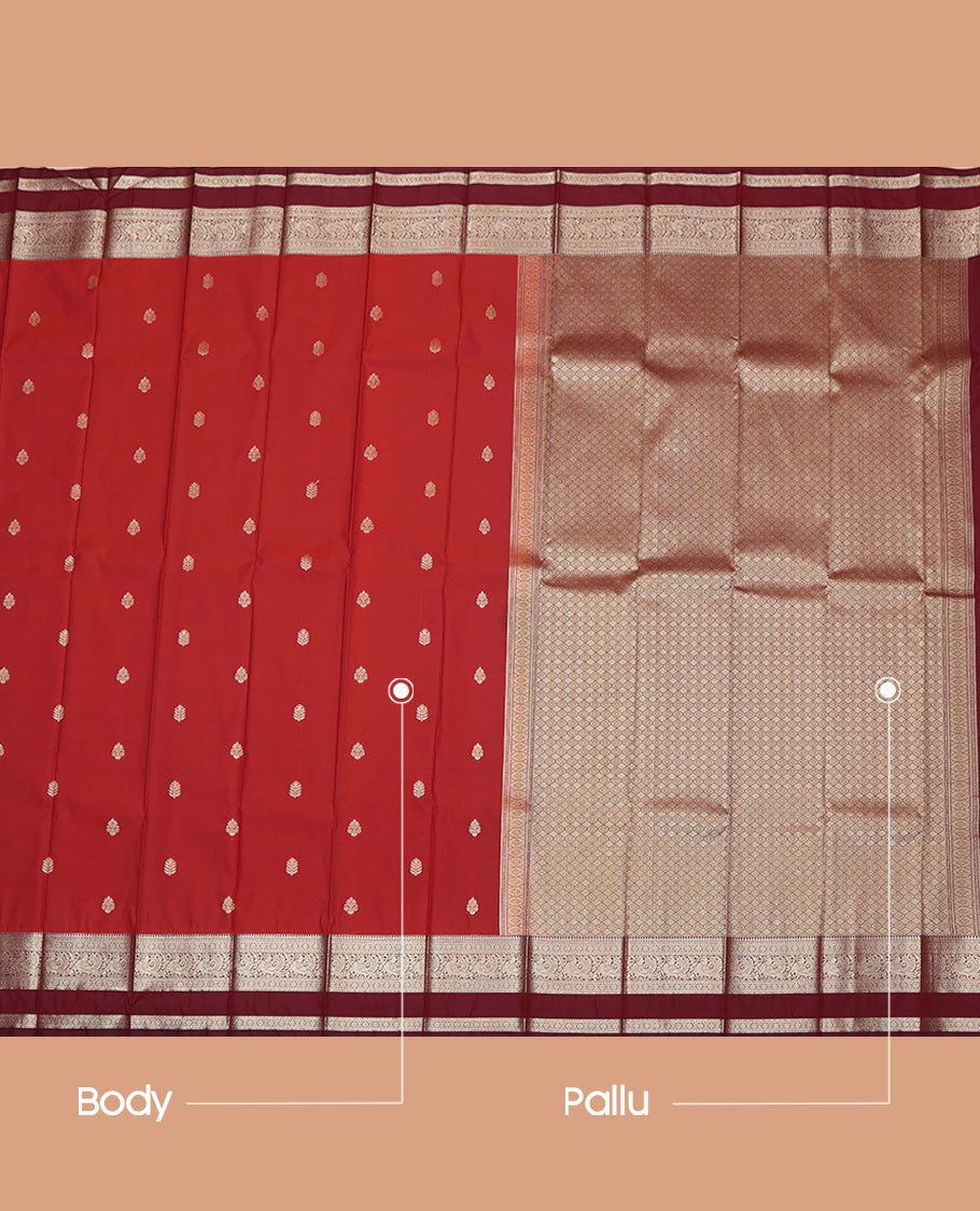 Red Budget Silk Saree, Adorned with Buttas All Over Its Body, Complemented by Contrast Rettai Pettu Traditional Zari Design Border of Peacocks, Jaal Pallu, and Paired with a Contrast Blouse