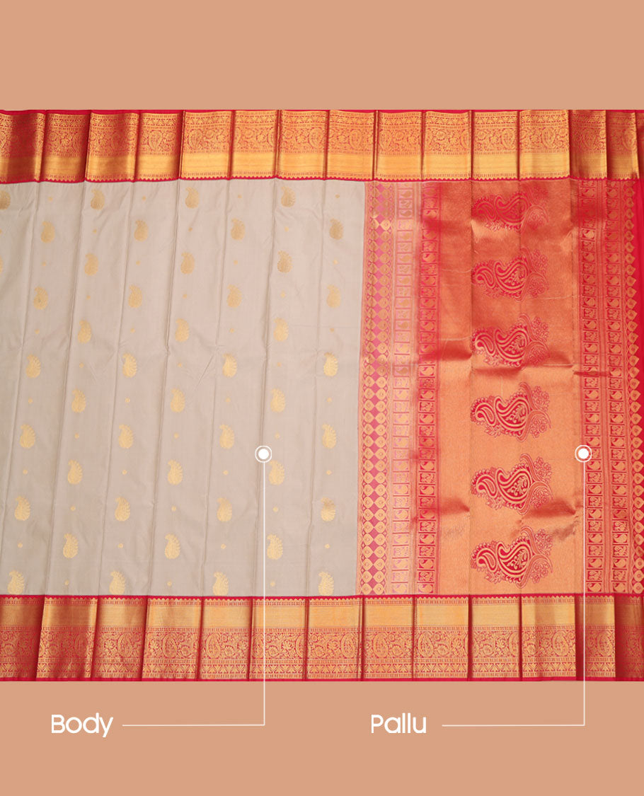 Grey Budget Silk Saree, Adorned with Zari Buttas All Across Its Body, Complemented by a Captivating Contrast Traditional Border of Floral-Paisley Designs, Pallu Steeped with Paisleys, and Paired with a Contrast Blouse