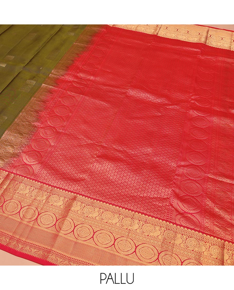 Green Vasundhara Silk Saree, Elevated with Zari Buttas on Its Body, Complemented by a Contrast Border of Thilakam Mokku, Muthu, Ara Maadam, Paisa, Kodi Visiry, and Annam Chakram Designs, Grandly Zari-Woven Pallu, and Paired with a Contrast Blouse