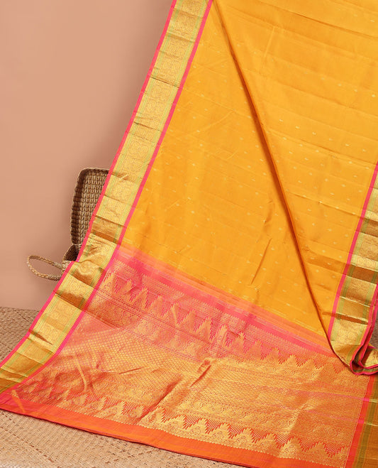 Orange leaf buttas kancheepuram silk saree with contrast border of sombu, paun, mayil design & zari design pallu