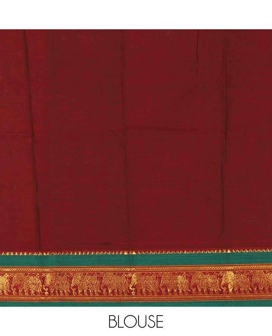 Maroon mercedised cotton half-saree, plain contrast elephant zari border skirt, matching blouse & contrast green zari elephant border dhavani