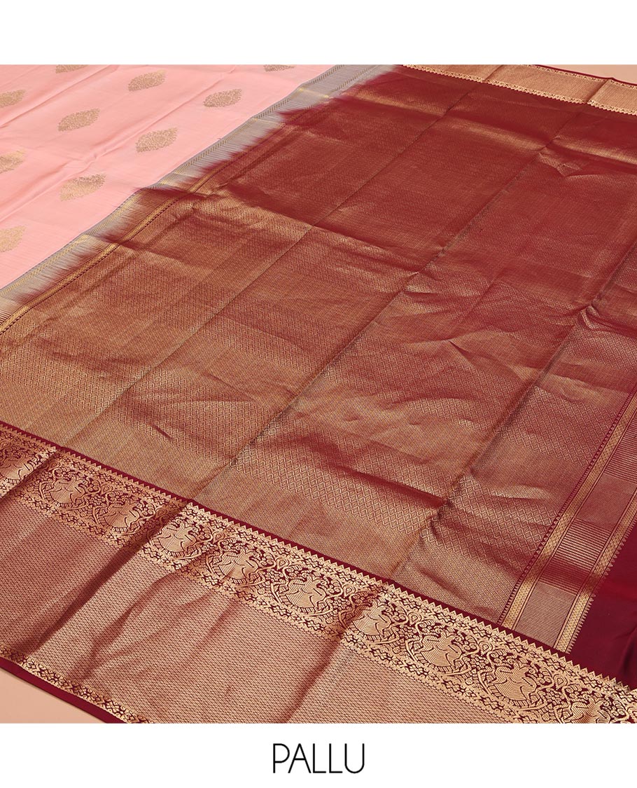Pink Vasundhara Silk Saree, Adorned with Zari Buttas All Over Its Body, Complemented by a Contrast Border of Rekku, Iruthalai Pakshi, and Mayil Kann Designs, Grand Jaal-Patterned Pallu, and Paired with a Contrast Blouse