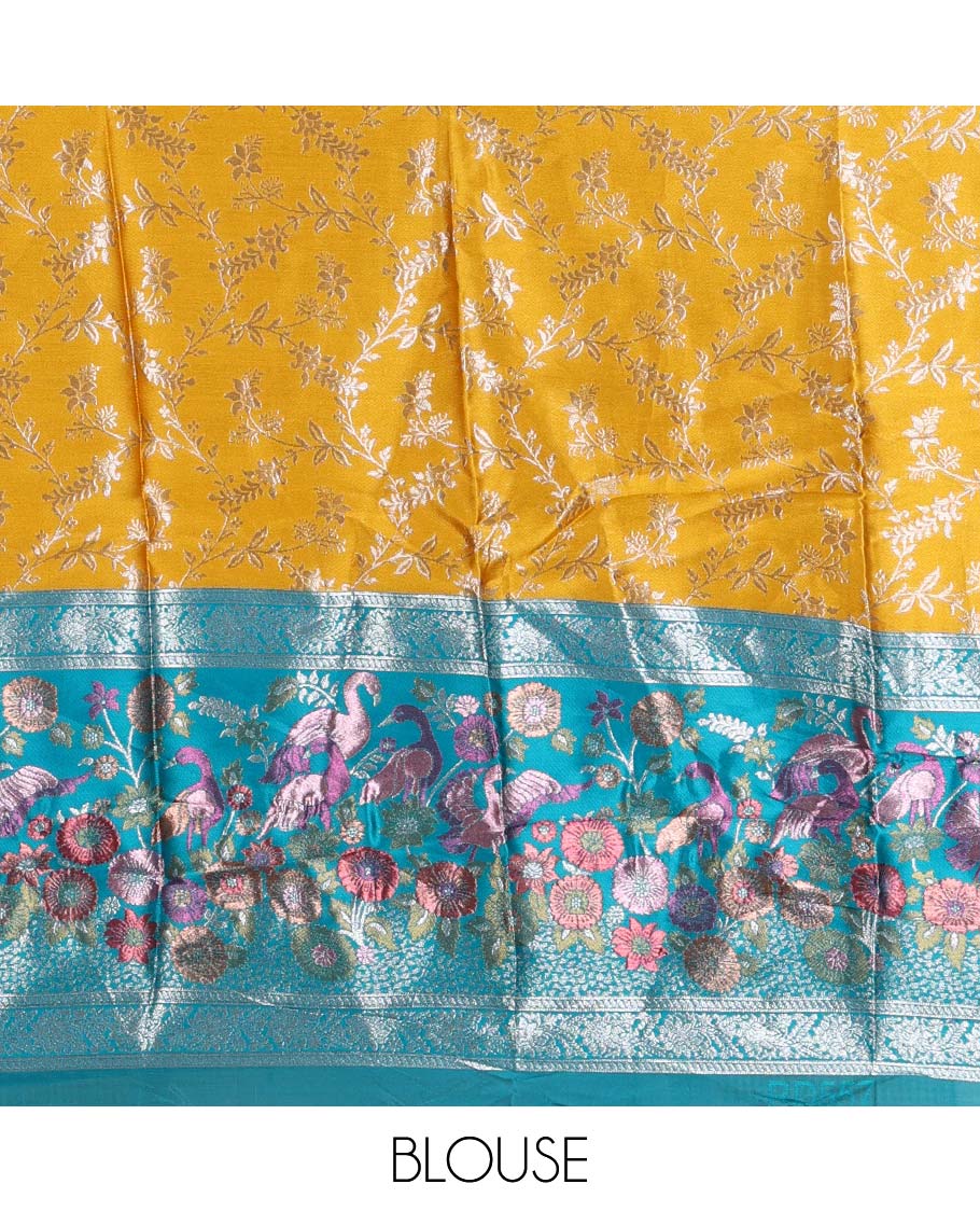 Haldi yellow taffeta silk half saree, floral jaal jacquard skirt, contrast green zari meenakari style bird border, matching blouse, and floral jaal dhavani