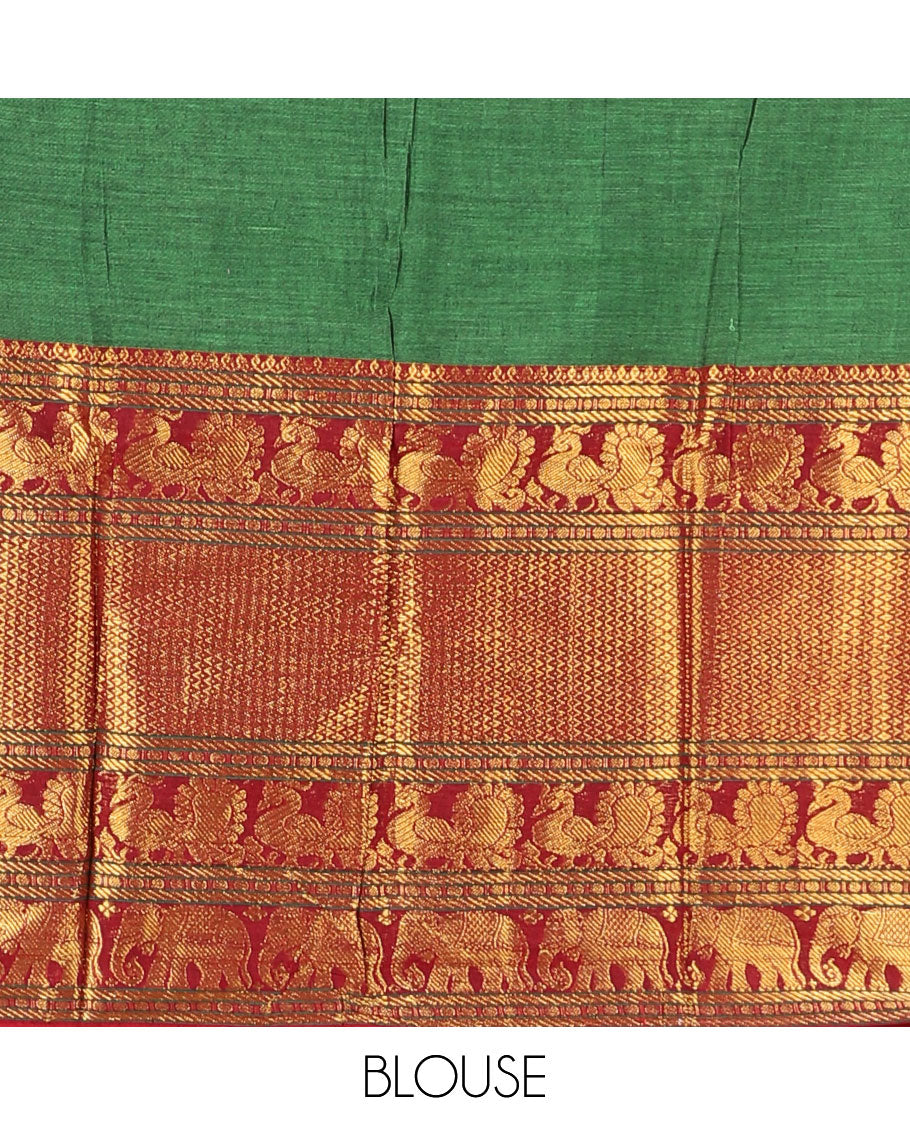 Green half-saree, plain with contrast traditional zari border skirt, matching zari bordered blouse, and contrast zari bordered dhavani