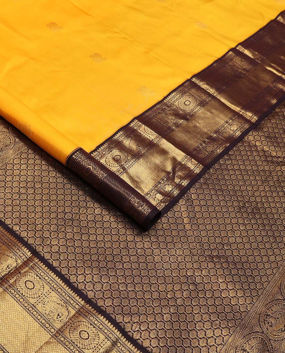 Yellow annam chakram buttas Kanchipuram korvai silk saree, contrast neer korvai border of thilakam mokku,muthu,diamond,round yaanai, chakram, and mayil kann, and pallu of poun designs