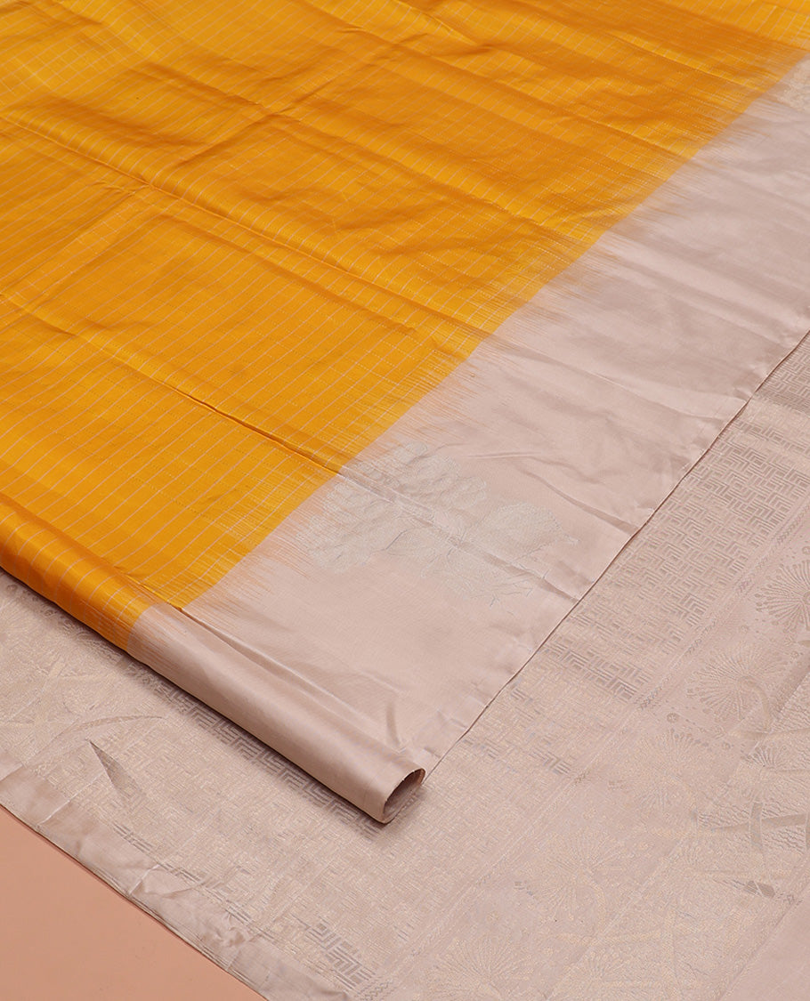 Yellow checked Kanchipuram silk saree, contrast border of zari buttas, and pallu of geometric patterns