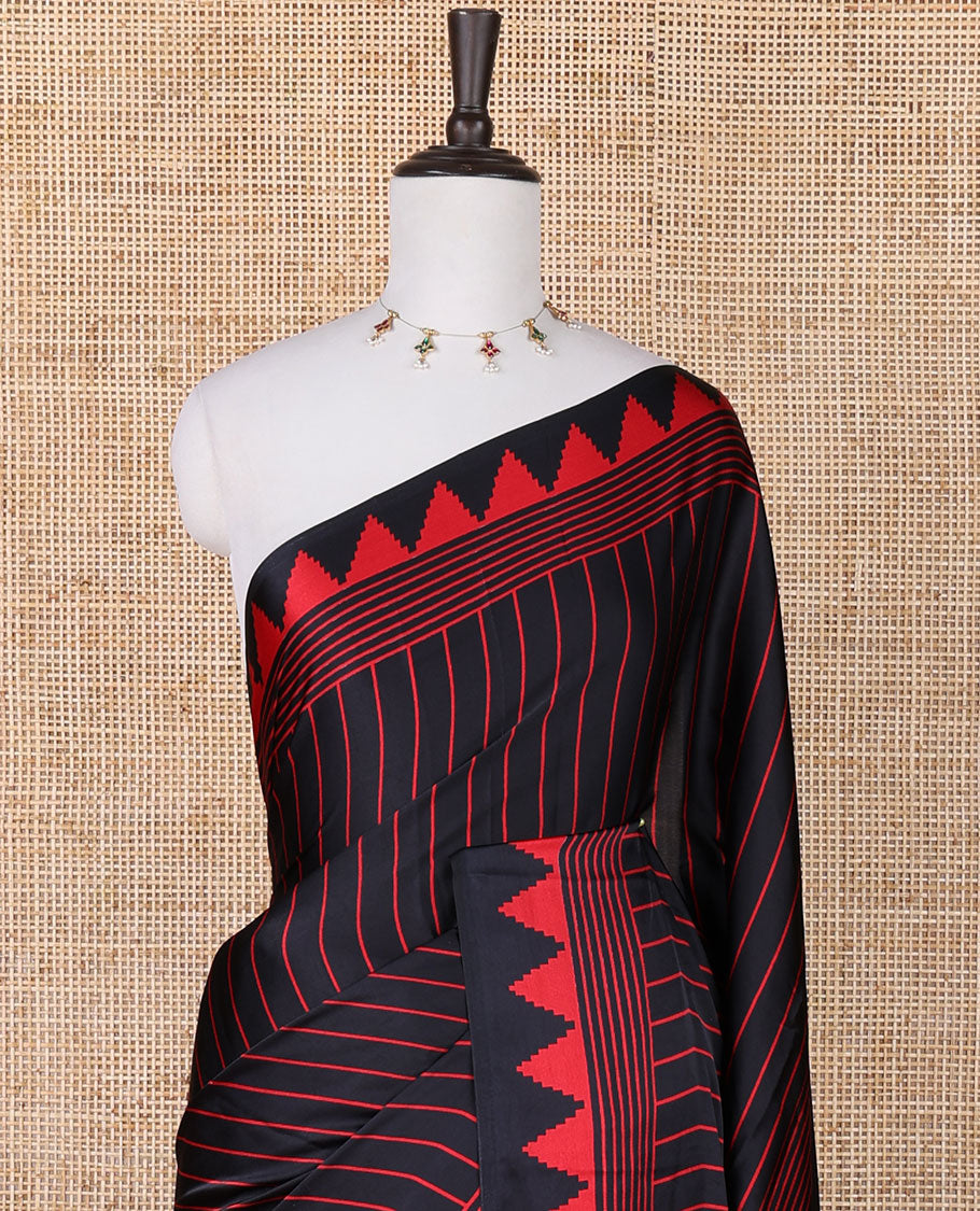 Black with red vertical lining printed design semi modal crepe saree with temple border & circle butta pallu along with printed blouse