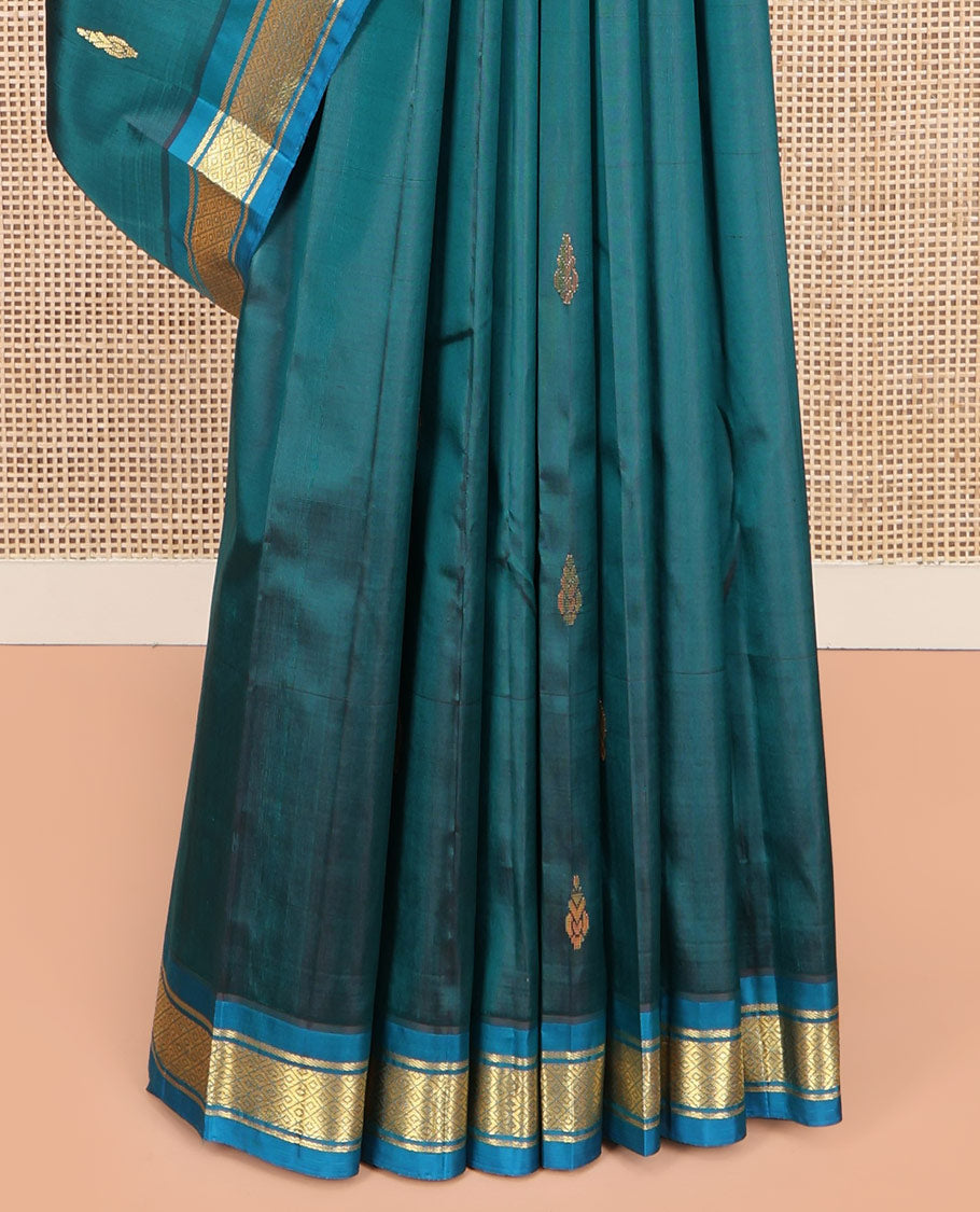 Blue Kanchipuram Silk Saree, Adorned with Zari Buttas on Its Body, Complemented by a Contrast One-Sided Border of Banaras, and Mayil Kann Designs, Pallu Steeped with Zari Designs, and Comes Without a Blouse