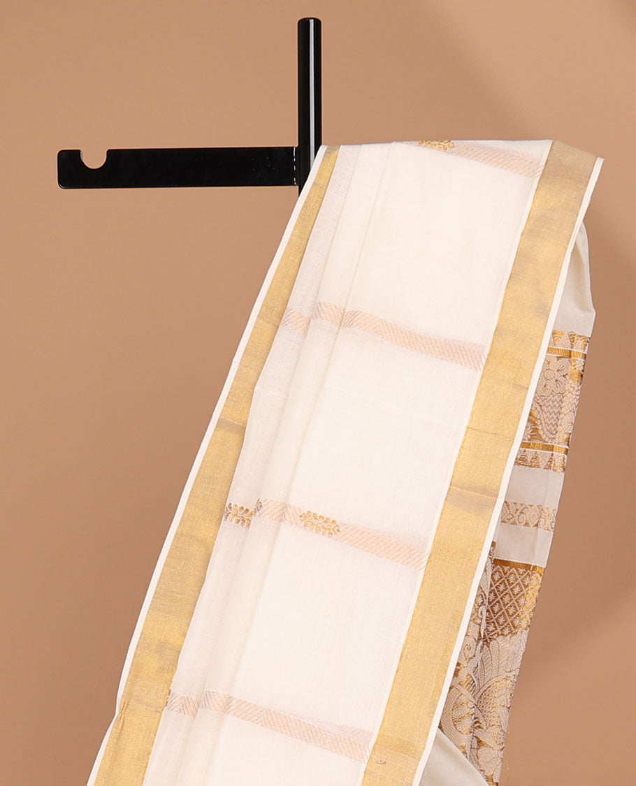 Cream kerala saree with zari stripes, zari border & pallu of traditional designs in zari