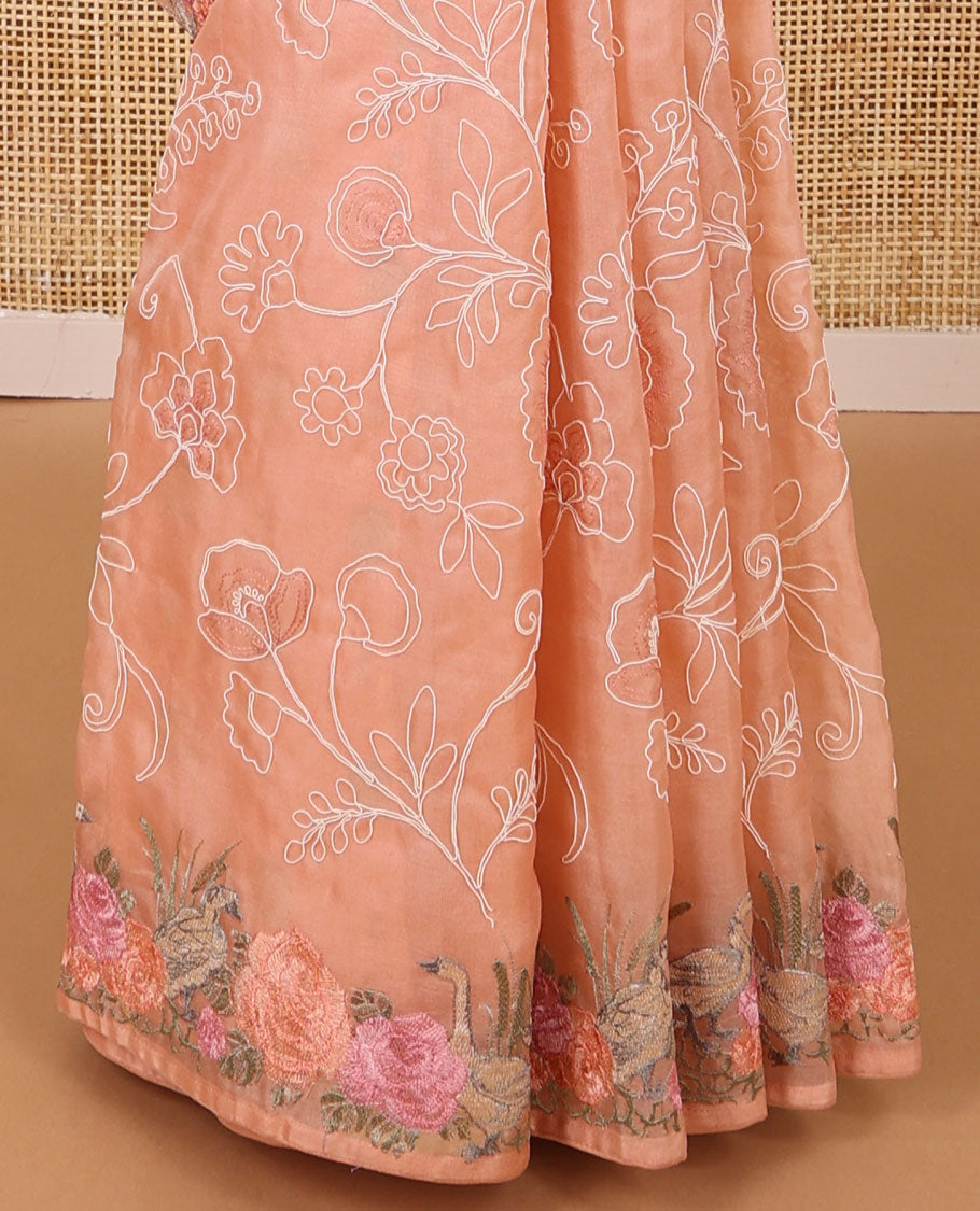 Orange floral thread embroidery organza saree with self floral, bird embroidery border