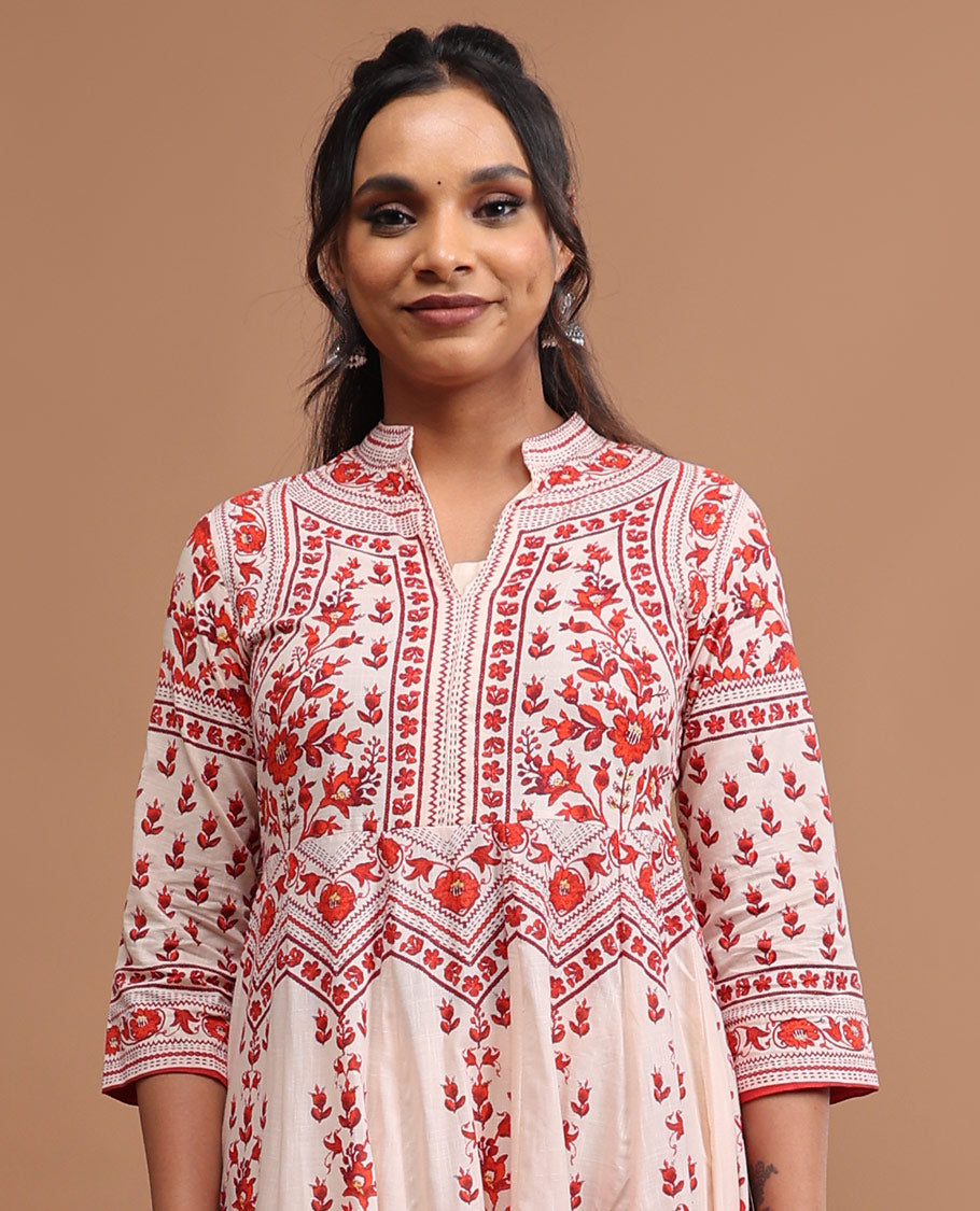 White floral design v neck, 3/4 th sleeve, below knee lenght top with straight pants
