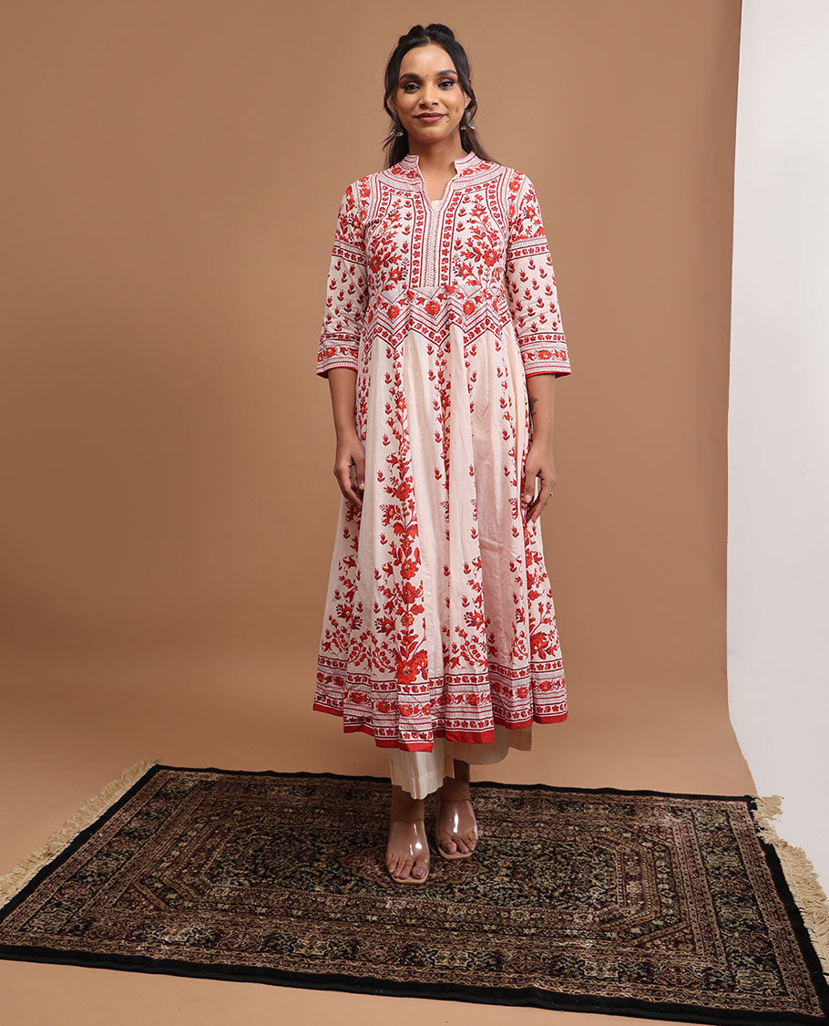 White floral design v neck, 3/4 th sleeve, below knee lenght top with straight pants