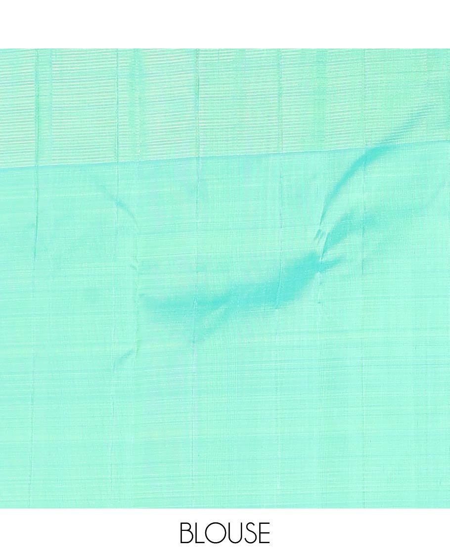 Green zari buttas Kanchipuram designer saree, contrast mayil butta enclosed thilakam design border, and jaal pallu