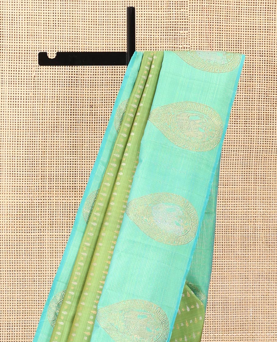 Green zari buttas Kanchipuram designer saree, contrast mayil butta enclosed thilakam design border, and jaal pallu
