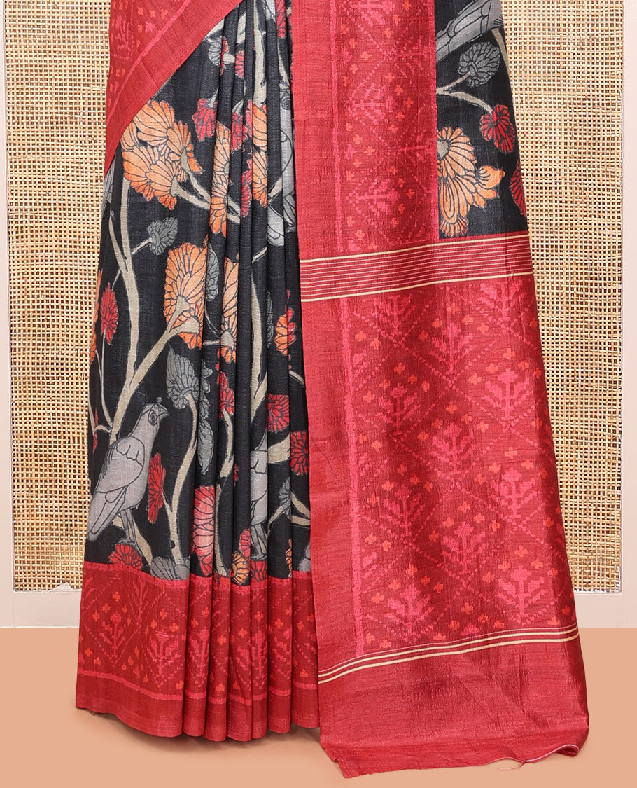 Black Fancy Tussar Saree Features Kalamkari Floral Vine and Bird Print, Contrast Patola Border, Patola Pallu, and a Contrast Blouse