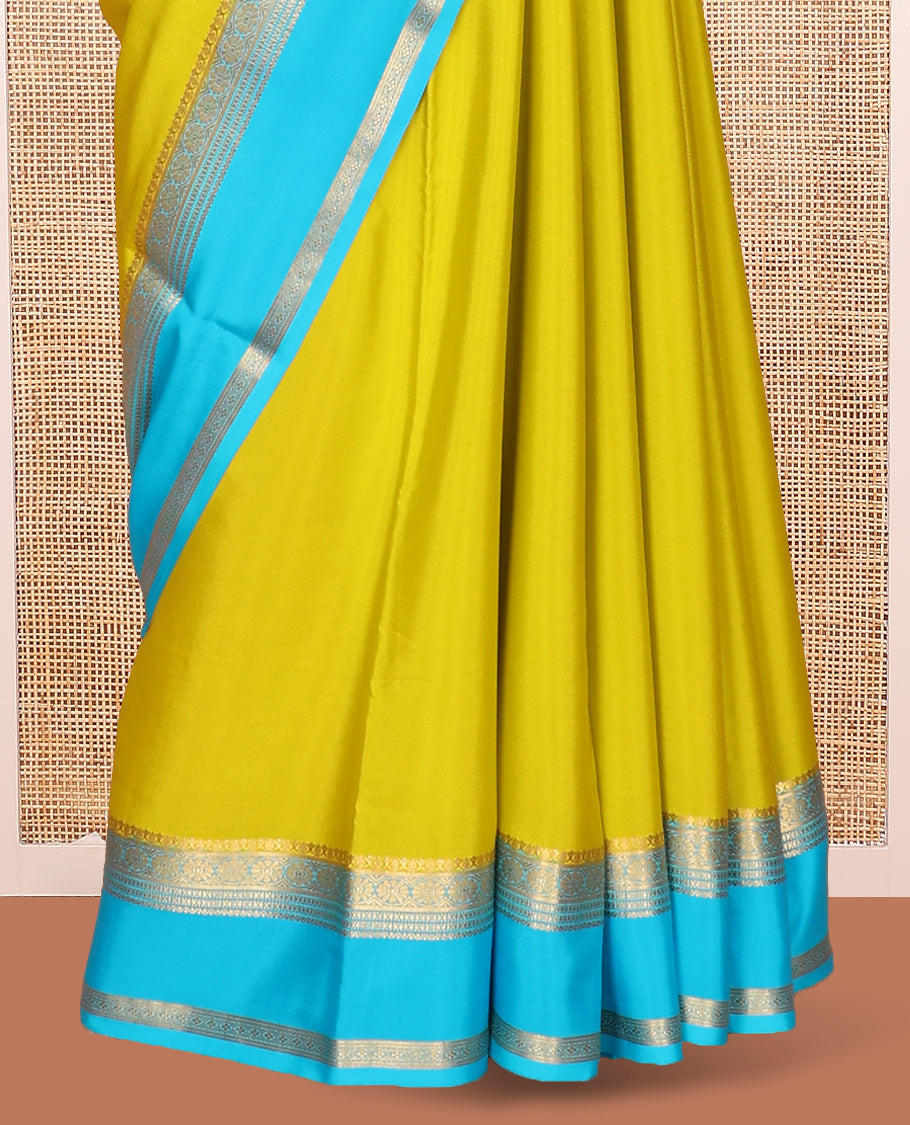 Green Plain Mysore Silk Saree, Complemented by Captivating Contrast Border of Traditional Zari Designs, Subtly Striped Pallu, and Paired with a Contrast Blouse