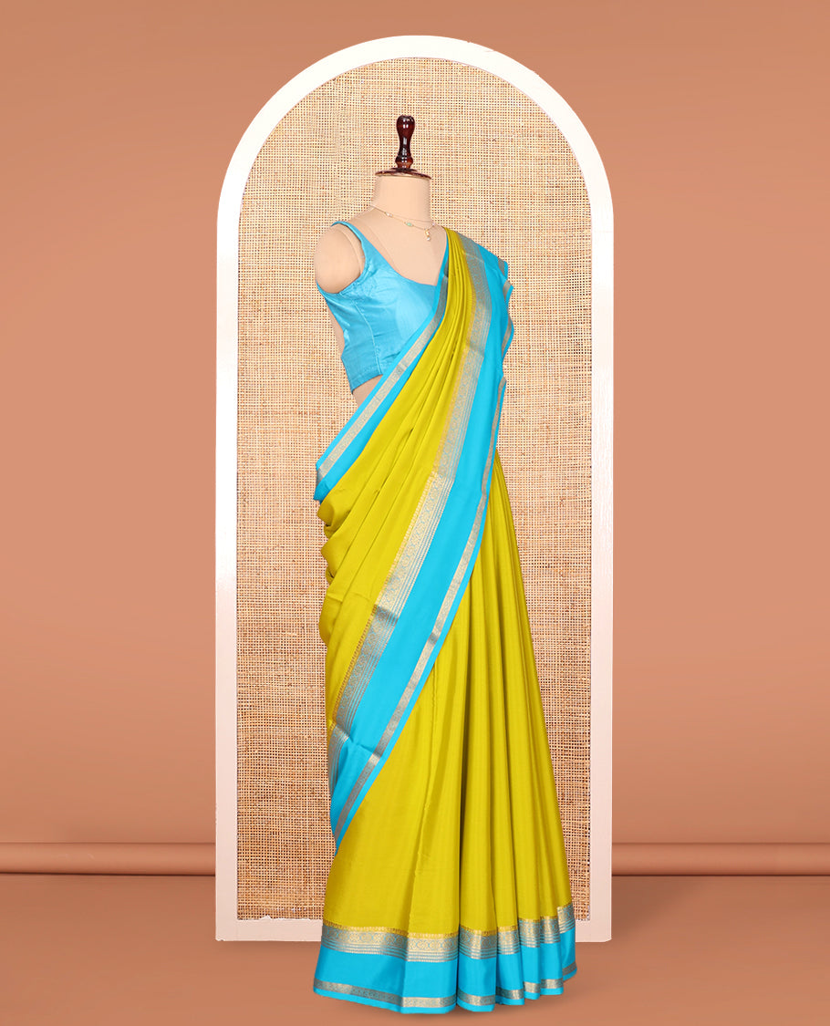 Green Plain Mysore Silk Saree, Complemented by Captivating Contrast Border of Traditional Zari Designs, Subtly Striped Pallu, and Paired with a Contrast Blouse