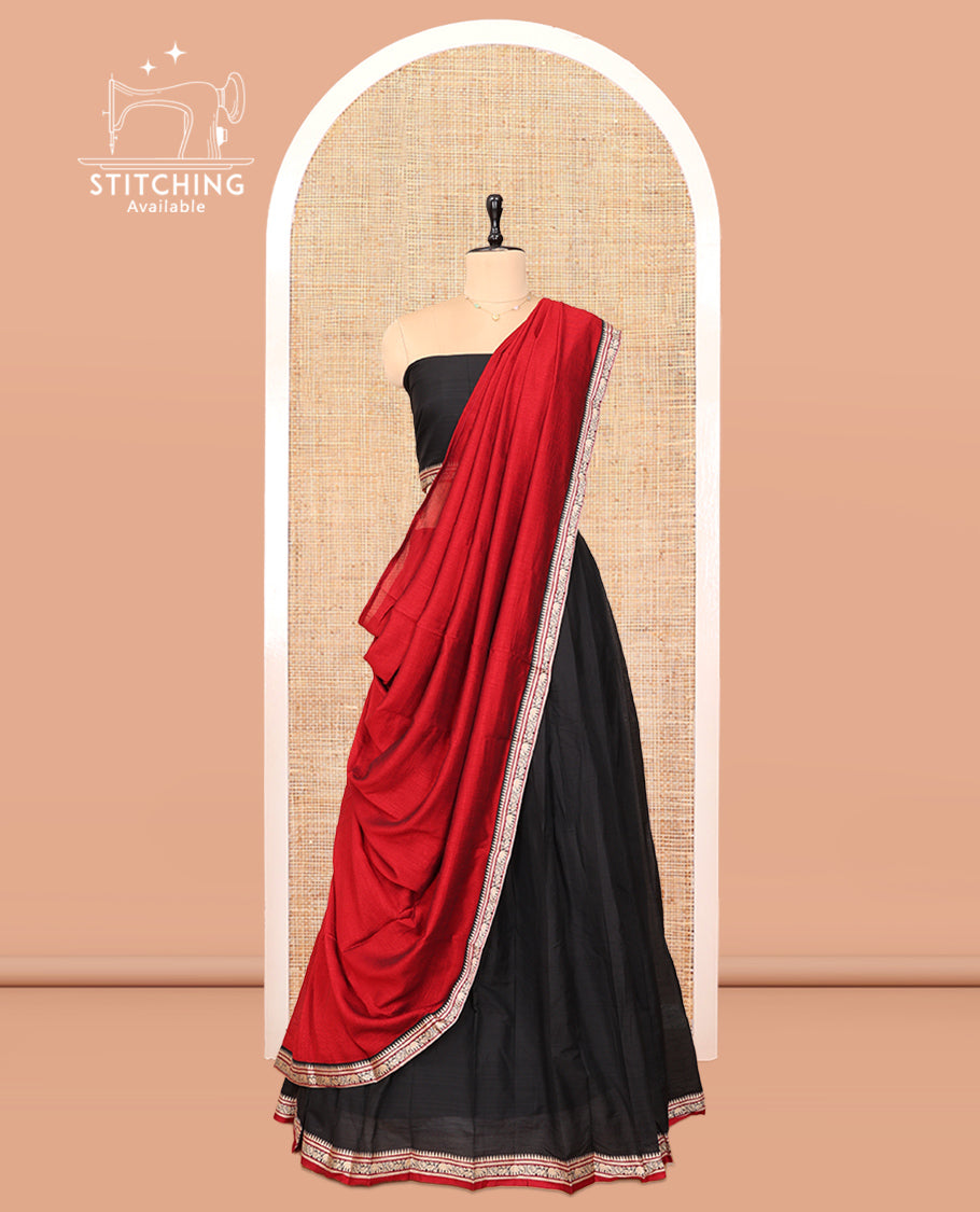 Black Cotton Half-Saree Features Plain Skirt, a Contrast Traditional Border, a Matching Blouse, and a Contrast Dhavani