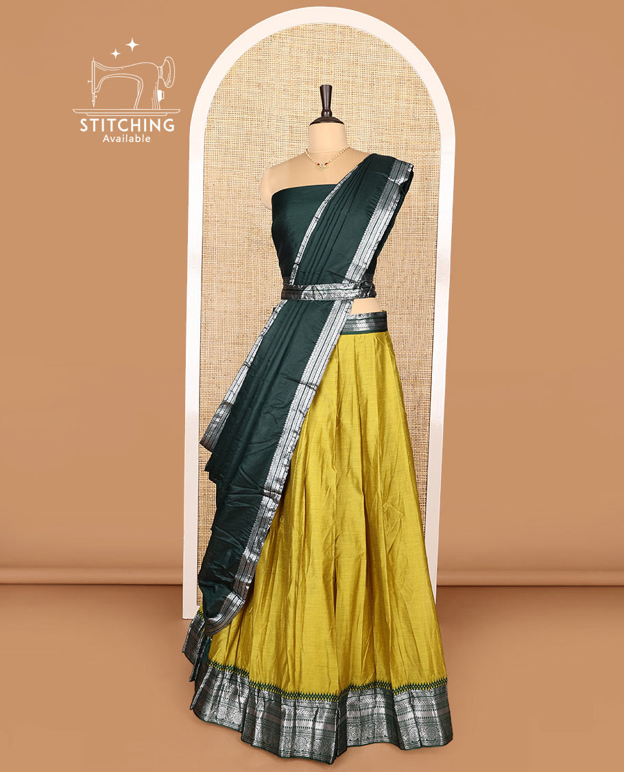 Green Art Silk Half-Saree Featuring Plain Skirt, Complemented by Contrast Traditional Zari Design Border, Paired with a Contrast Blouse, Contrast Zari-Bordered Dhavani, and Brocade Belt