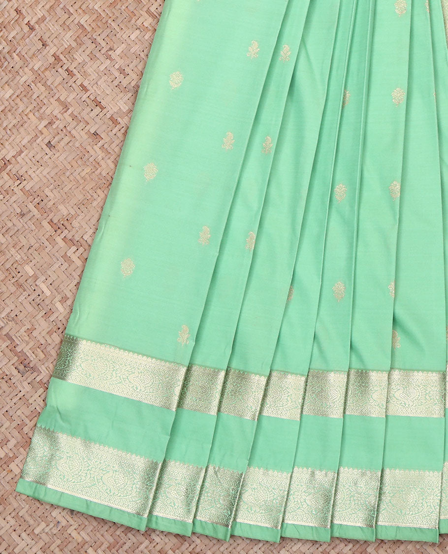 Green Budget Silk Saree, Accentuated with Zari Buttas All Over Its Body, Highlighted by Rettai Pettu Traditional Zari Design Border of Peacocks, Intricately Designed Jaal Pallu, and Paired with a Matching Blouse