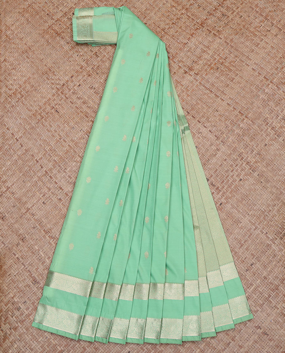 Green Budget Silk Saree, Accentuated with Zari Buttas All Over Its Body, Highlighted by Rettai Pettu Traditional Zari Design Border of Peacocks, Intricately Designed Jaal Pallu, and Paired with a Matching Blouse