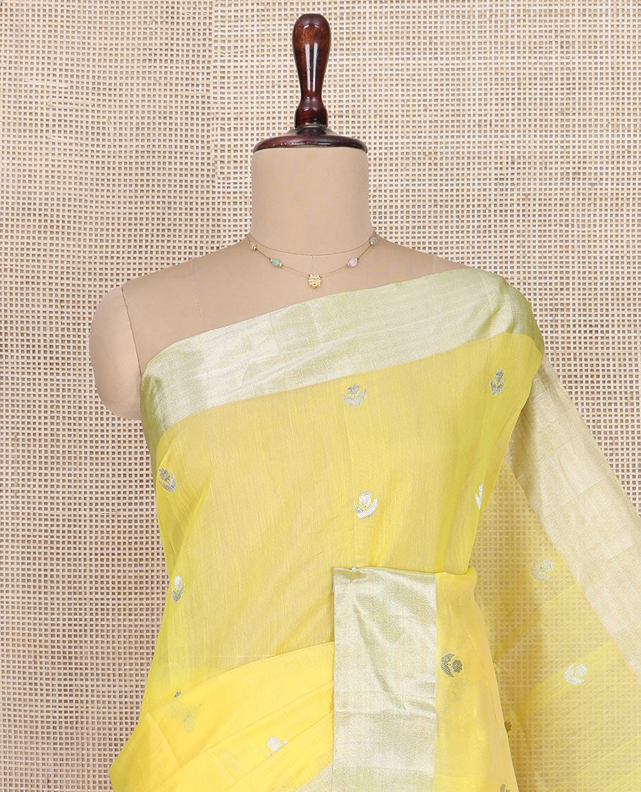 Yellow Chanderi Cotton Saree, Sparkled with Buttas All Over Its Body, Highlighted by a Zari Border, Pallu Steeped with Zari Designs, and Paired with a Matching Blouse