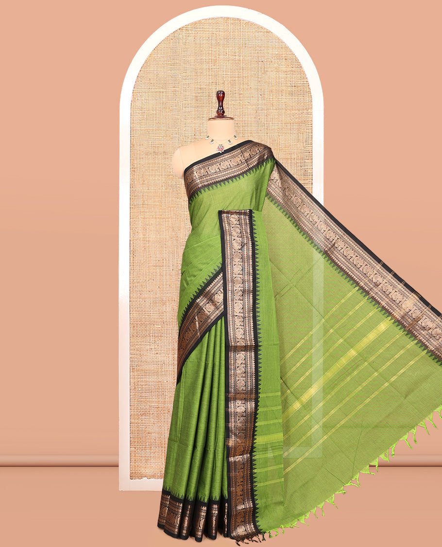 Green Plain Chettinad Cotton Saree, Enhanced by a Contrast Traditional Temple Peacock Border, a Striped Pallu and a Matching Blouse