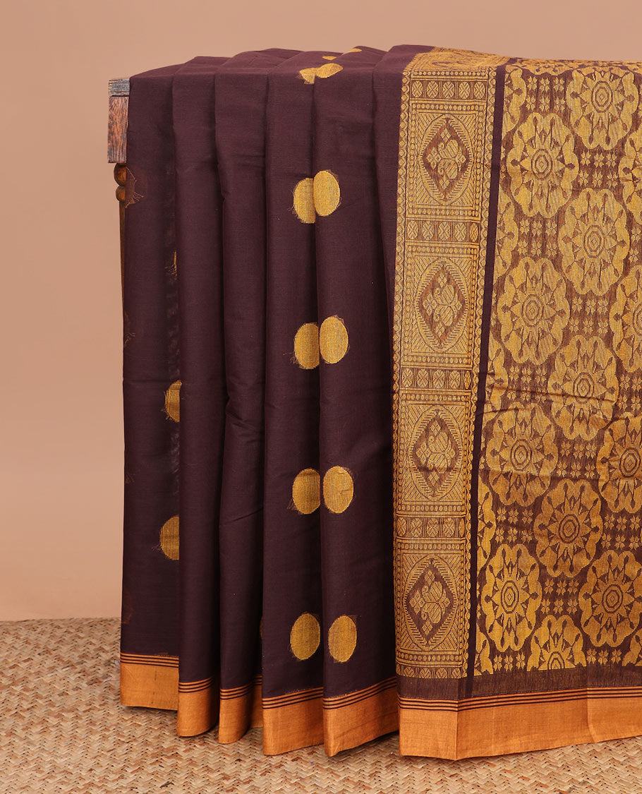 Brown polka dot buttas kanchi cotton saree, contrast border, and chakram design pallu