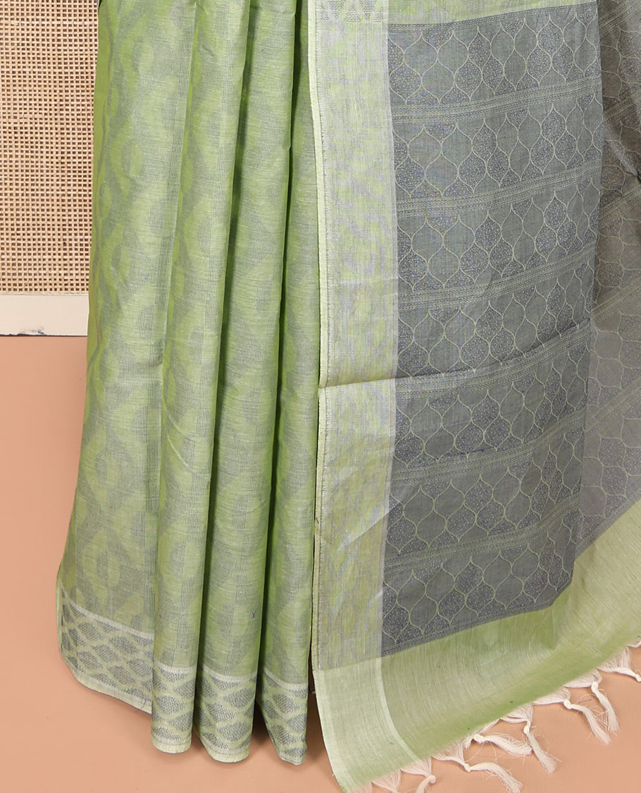 Pale Green Coimbatore Cotton Saree, Subtly Sparkled with Geometric Design on Its Body, a Subtle Diamond Border, Pallu of Ogee Patterns, and Paired with Matching Blouse