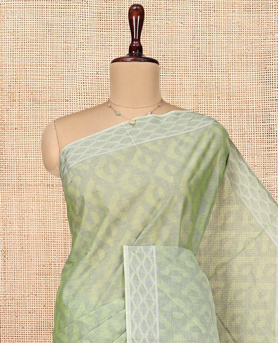 Pale Green Coimbatore Cotton Saree, Subtly Sparkled with Geometric Design on Its Body, a Subtle Diamond Border, Pallu of Ogee Patterns, and Paired with Matching Blouse