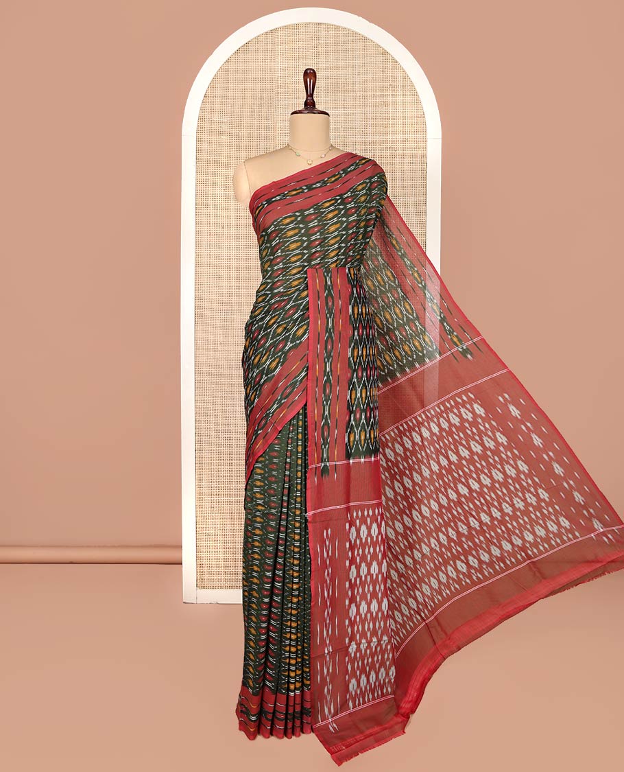 Green Ikkat Cotton Saree, Elevated with Ikkat-Style Ogee Patterns on Its Body, Complemented by Contrast Ikkat-Style Border, Pallu of Ikkat Buttas, and Has No Blouse