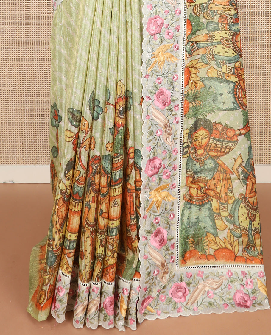 Pastel green buttas with bandhani and kalamkari floral-human motifs printed dola silk saree, contrast floral embroidered scallop border