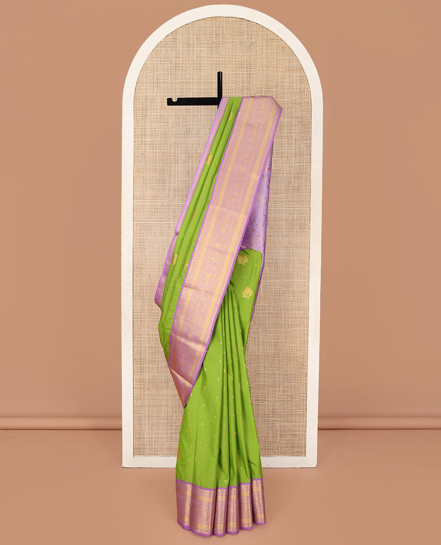Parrot Green Budget Silk Saree, Embellished with Zari Buttas on Its Body, Complemented by a Contrast Traditional Zari Design Border, Grandly Decked Up Pallu, and Paired with a Contrast Blouse