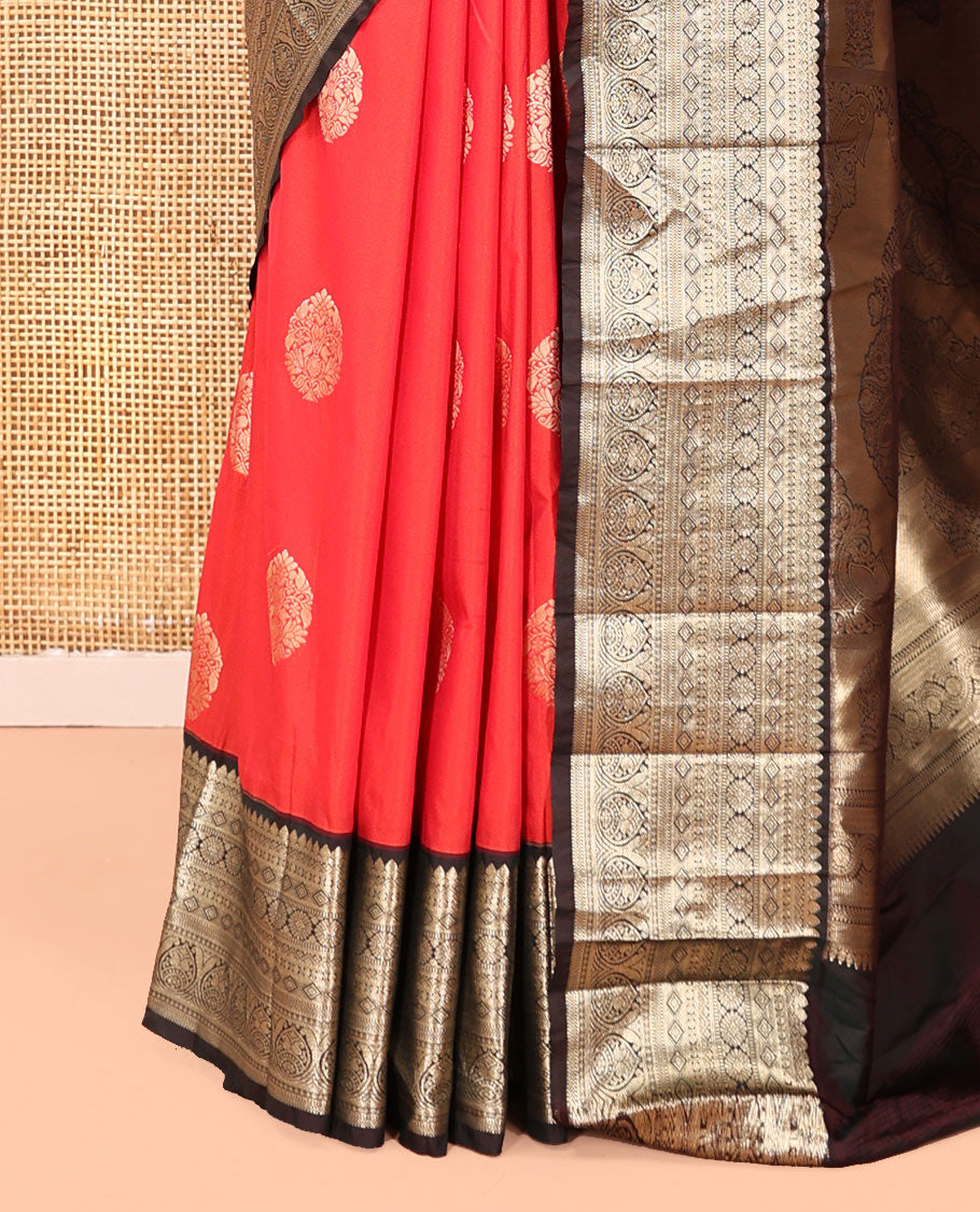 Reddish Orange Budget Silk Saree, Elevated with Floral Zari Buttas All Over Its Body, Complemented by Contrast Traditional Zari Designs Woven Big Border, Grandly Decked Up Pallu, and Paired with a Contrast Blouse