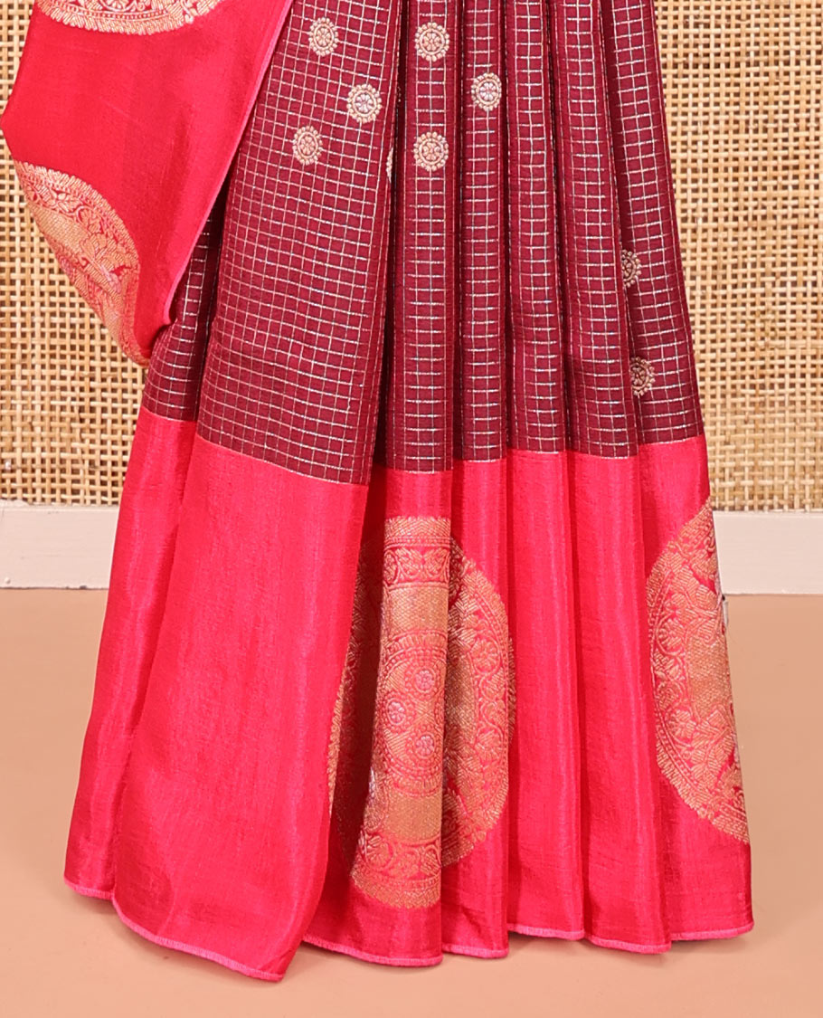 Maroon H O-Silk Saree, Elegantly Detailed with Zari Buttas and Zari Checks On Its Body, Accentuated with Contrast Big Chakram Motifs Woven Border, Grand Jaal Design Woven Pallu, and Paired with a Checked Blouse