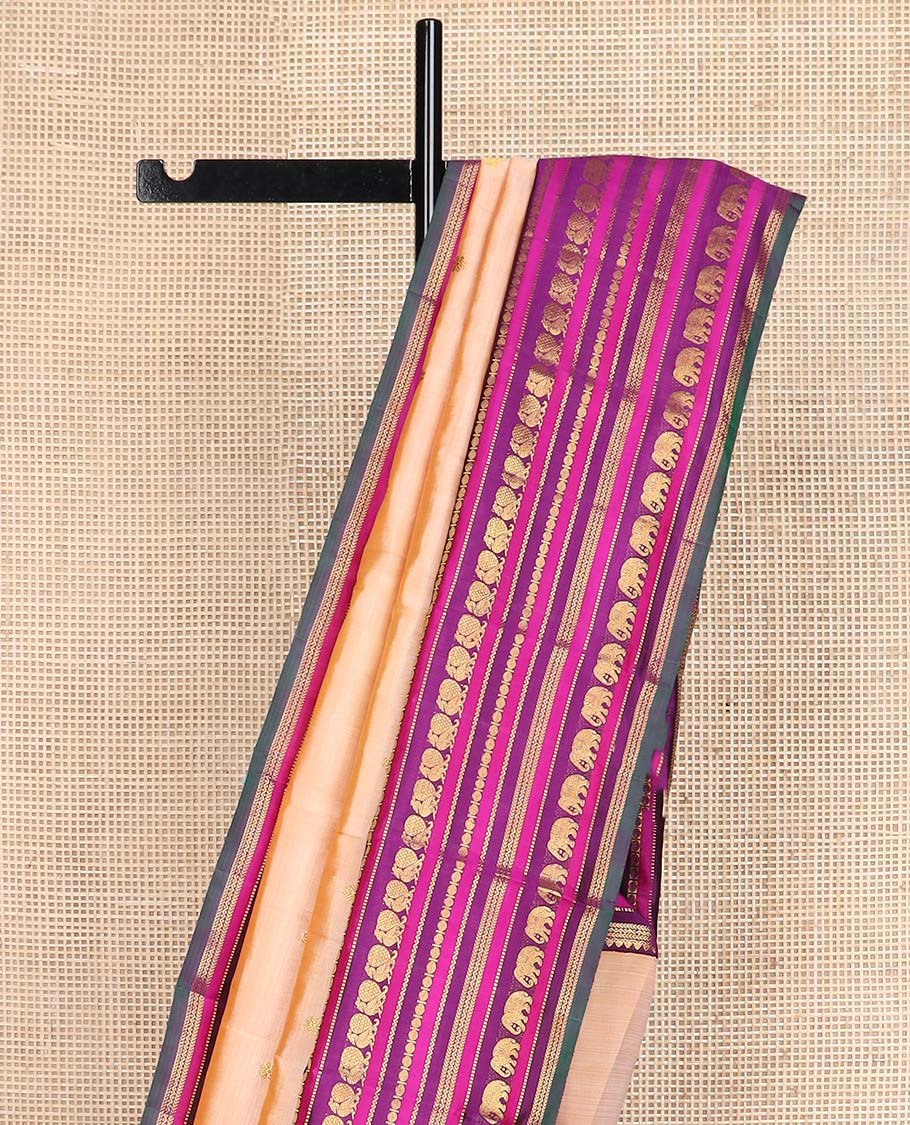 Sandal zari buttas Kanchipuram silksaree, contrast border of thilakam, muthu, laddu kamalam, mayil, and yaanai designs, and butta enclosed checked pallu