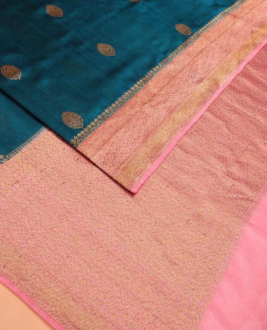 Blue Raw Mango Silk Saree Graced with Buttas, Complemented by a Contrast Traditional Zari-Designed Border, Featuring a Zari-Elevated Pallu, Paired with a Contrast Zari-Striped Blouse