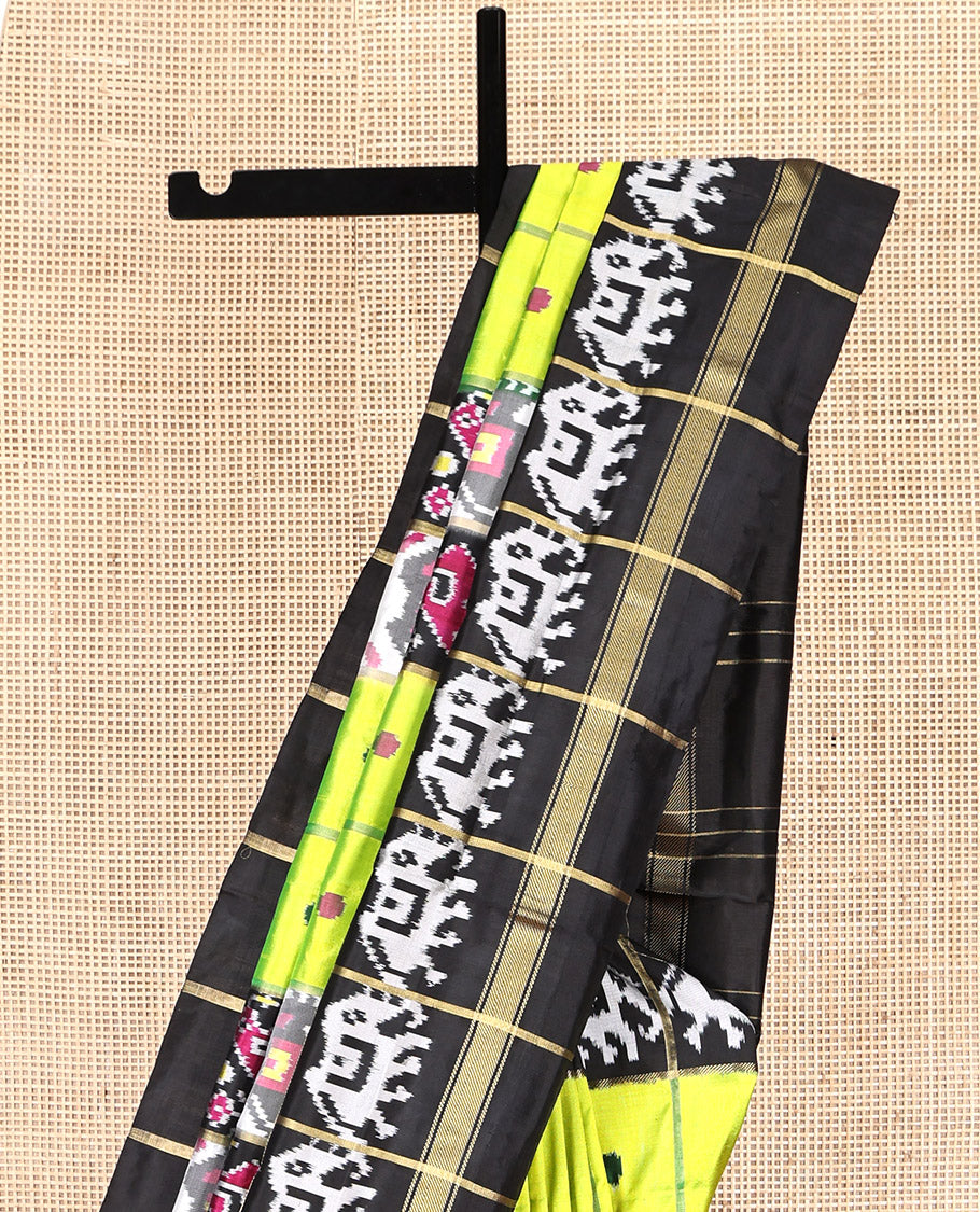 Green Pochampally Ikat Silk Saree, Styled with Patola-Style Animal Butta Enclosed Checks, Complemented by a Contrast Elephant Border, Animal Butta Enclosed Checks Pallu, and Contrast Blouse