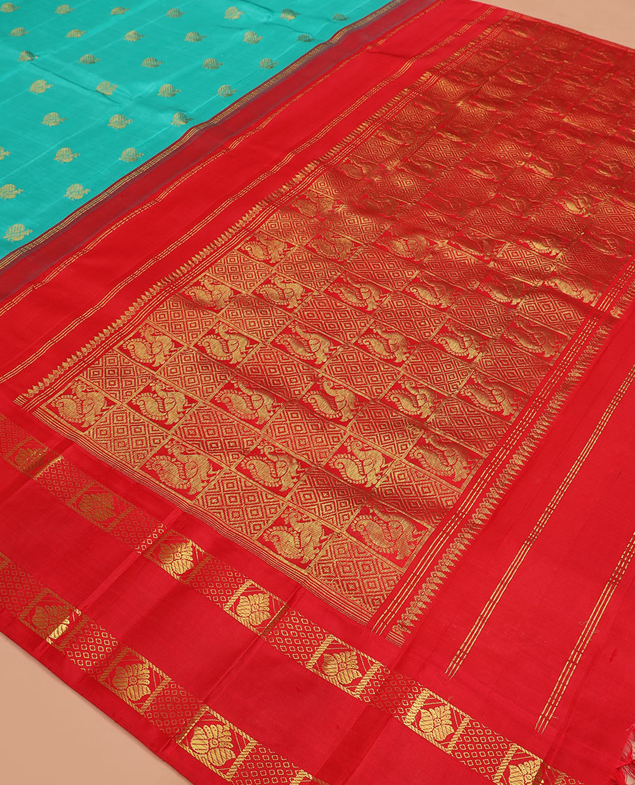 Blue mayil buttas Kanchipuram silk saree, contrast one-sided rettai pettu korvai border of zari designs, and pallu of diamond grid and mayil designs