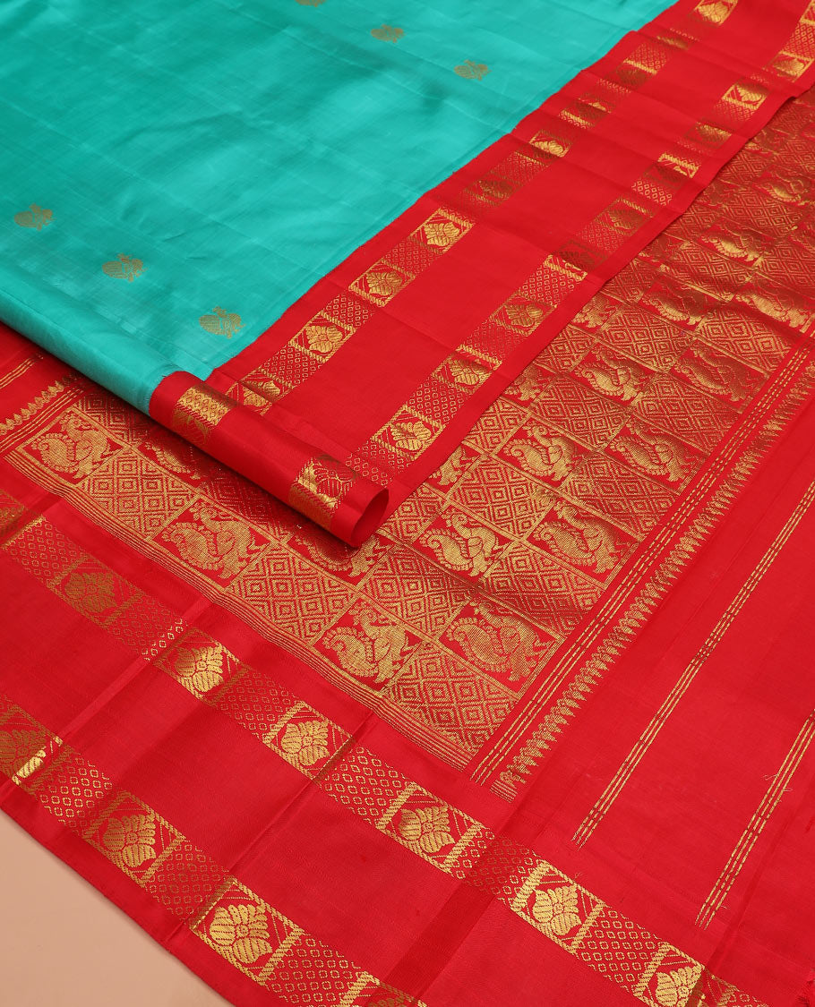 Blue mayil buttas Kanchipuram silk saree, contrast one-sided rettai pettu korvai border of zari designs, and pallu of diamond grid and mayil designs