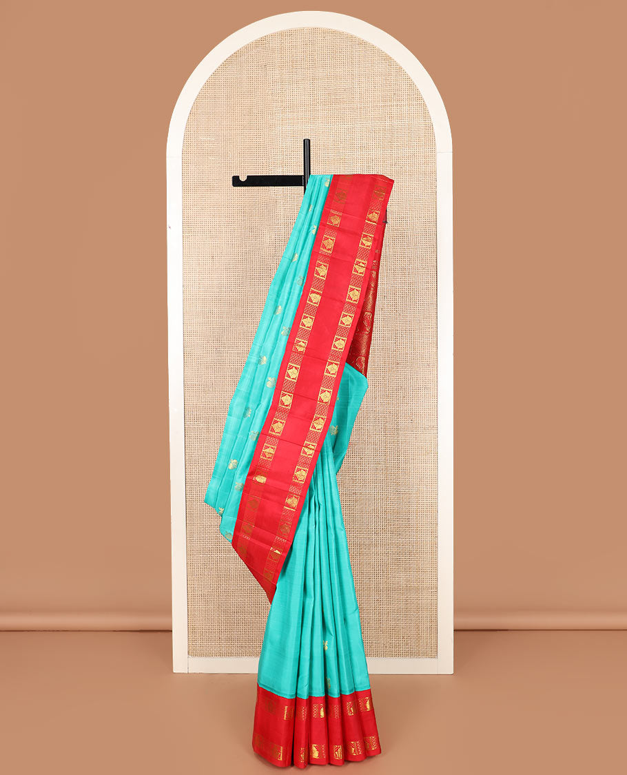Blue mayil buttas Kanchipuram silk saree, contrast one-sided rettai pettu korvai border of zari designs, and pallu of diamond grid and mayil designs