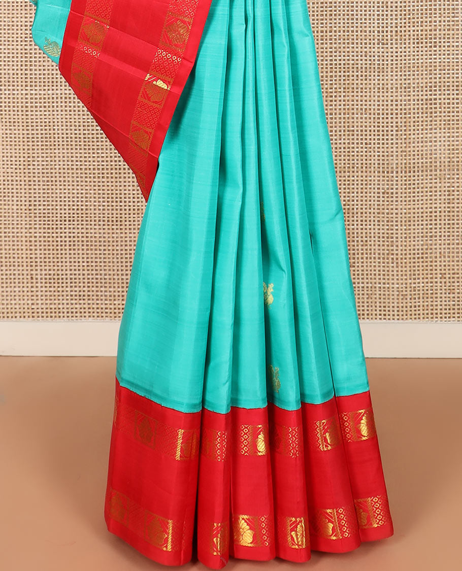 Blue mayil buttas Kanchipuram silk saree, contrast one-sided rettai pettu korvai border of zari designs, and pallu of diamond grid and mayil designs