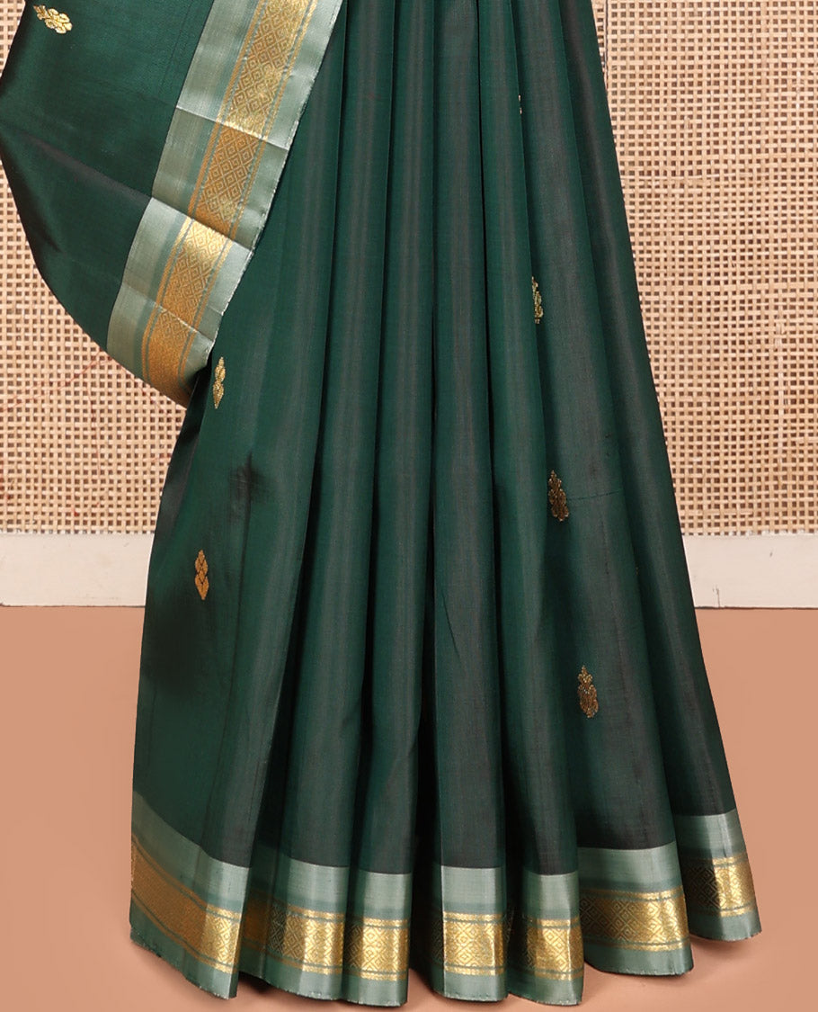 Green Kanchipuram Silk Saree, Embellished with Zari Buttas, a Contrast One-Sided Border of Mayil Kann Designs, a Zari-Design Pallu, and No Blouse