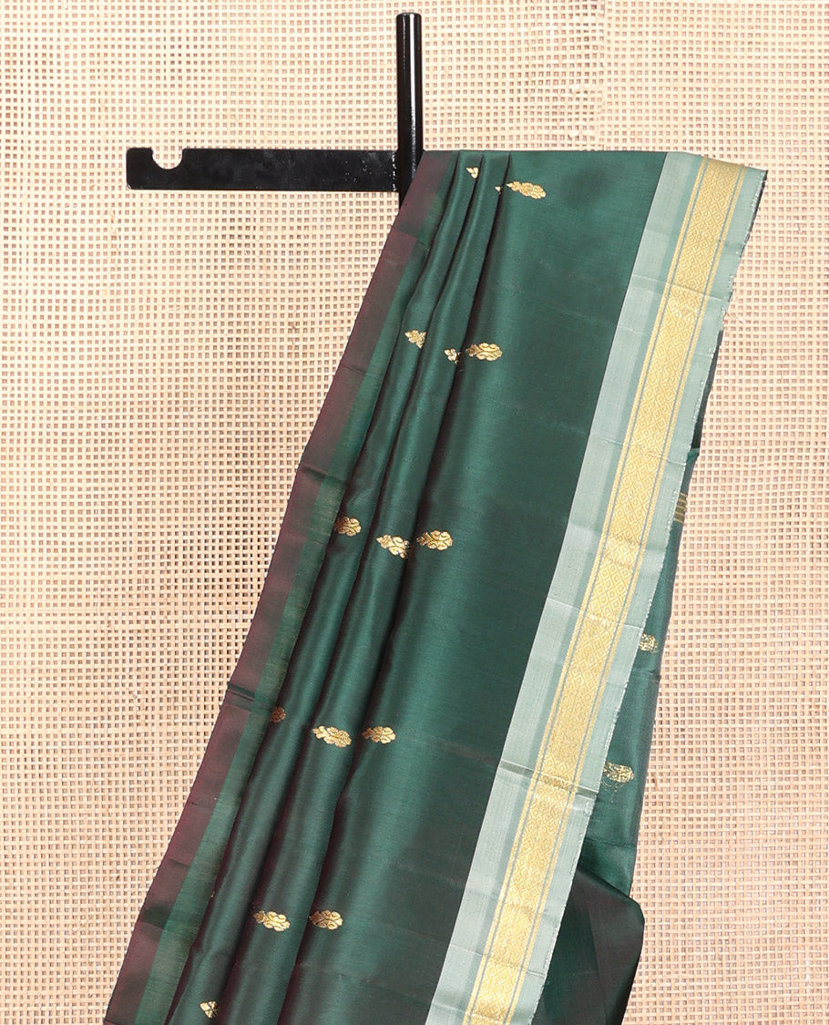 Green Kanchipuram Silk Saree, Embellished with Zari Buttas, a Contrast One-Sided Border of Mayil Kann Designs, a Zari-Design Pallu, and No Blouse