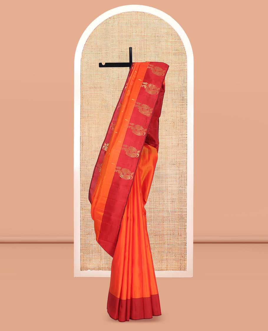 Orange Kanchipuram Silk Saree, Embellished with Zari Buttas, Complemented by a Contrast Mayil Border, Floral Design Pallu, and a Contrast Blouse