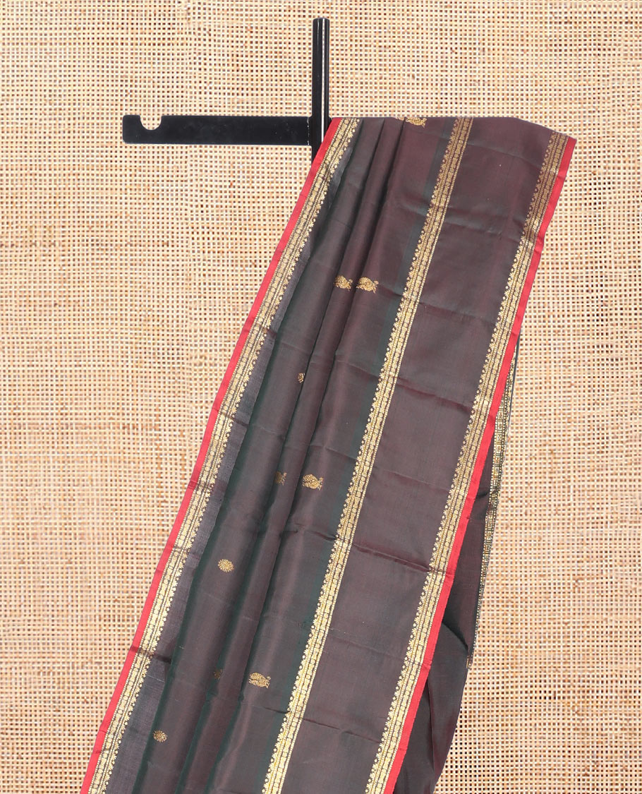 Brown Kanchipuram Silk Saree, Embellished with Mayil-Chakram Buttas, Highlighted by a Rettai Pettu Border, Grand Jaal Pallu, and Matching Blouse