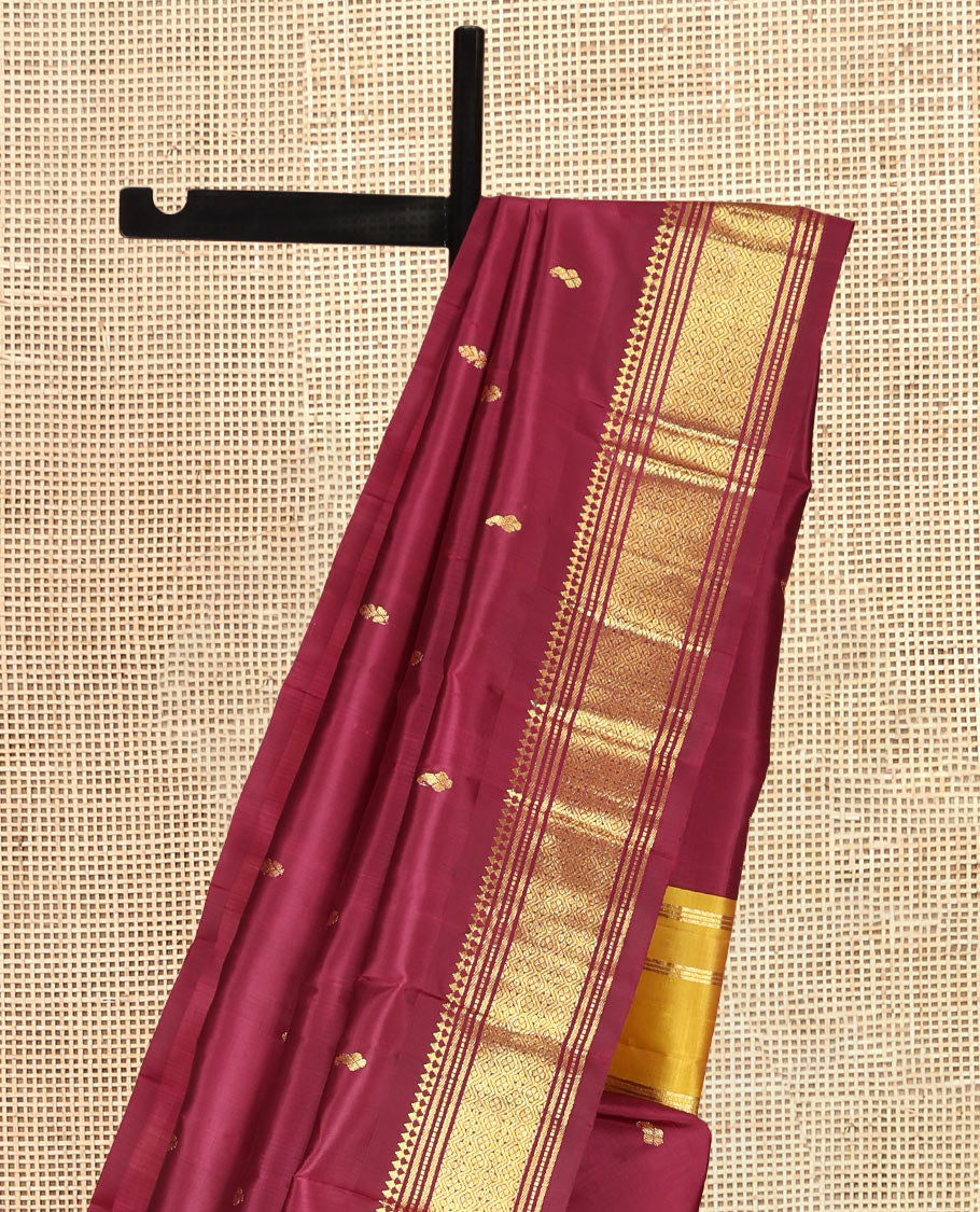 Maroon Kanchipuram Silk Saree, Graced with Zari Buttas, Highlighted by a One-Sided Zari Border of Panner Sombu, Banaras, Muthu, and Jaal Designs, Contrast Grand Pallu, and a No Blouse