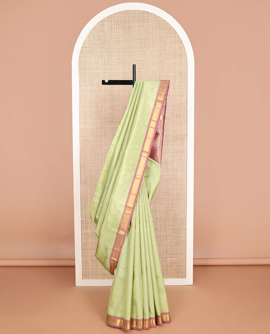 Mint green buttas kancheepuram silk saree with contrast border of banaras, kuyil kann design & zari design pallu
